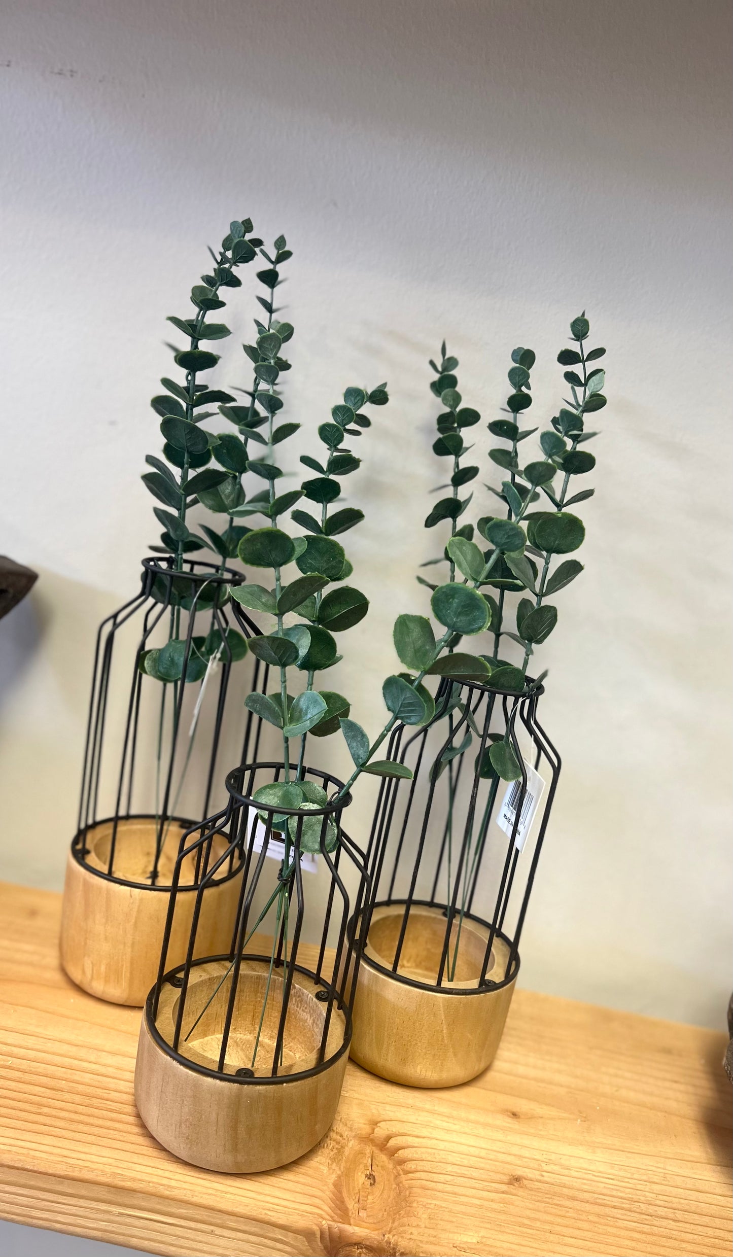 Wire vase with greenery